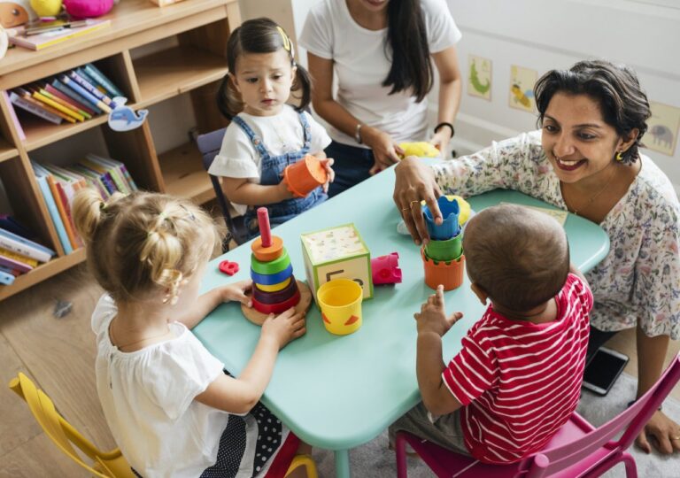 nursery-children-playing-with-teacher-in-the-classroom.jpg