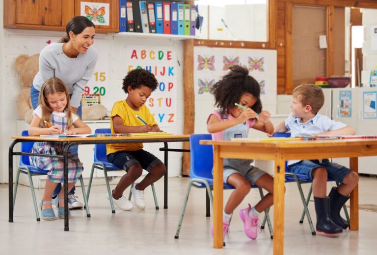 shot-of-a-young-woman-teaching-a-class-of-preschool-children.jpg